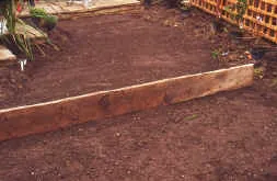 A straight edge timber for a perfectly laid lawn